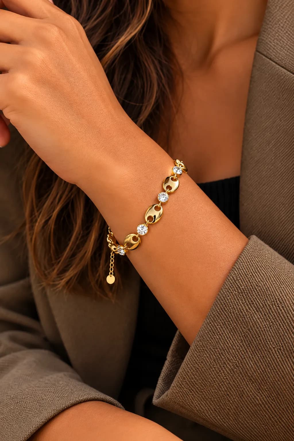 Schakelarmband goud met ovale schakels en steentjes