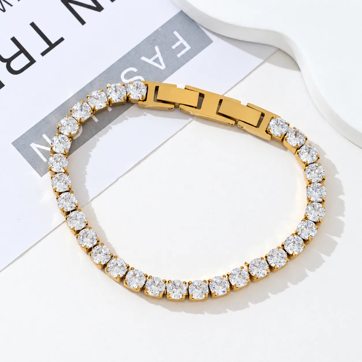 Gouden tennis armband met ronde steentjes